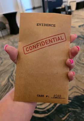 We are at a professional networking event and the theme is MissionPossible We created these evidence packets to hold our marketing materials Inside is a flashlight magnifying glass pen and business card Everyone loves them