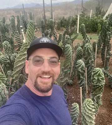 Richardson 112 Trucker Snapback Cap - This is Emerson one of the founders of RootWorks He is wearing his hat while visiting one of our clients