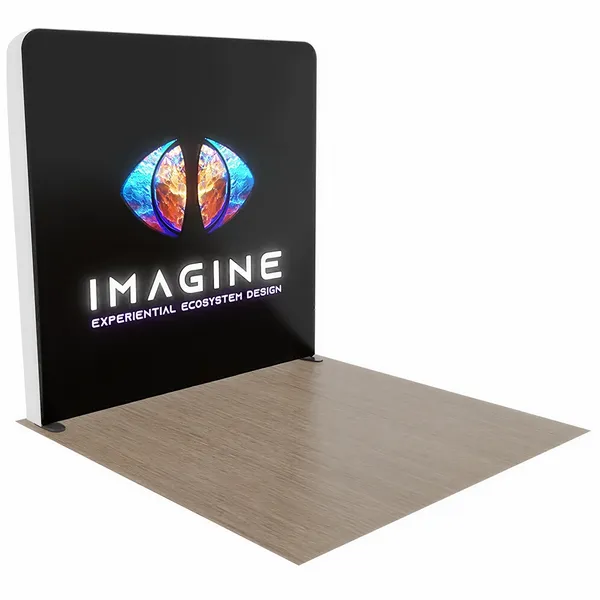A black display panel features a colorful logo resembling an eye above the word 'IMAGINE' followed by 'EXPERIENTIAL ECOSYSTEM DESIGN,' placed in an indoor setting with a wooden floor.